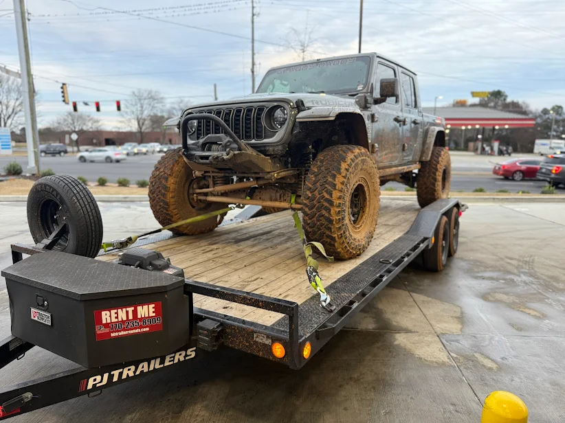 Gray Jeep Gladiator Rubicon on a PJ Trailers Rent Me flatbed