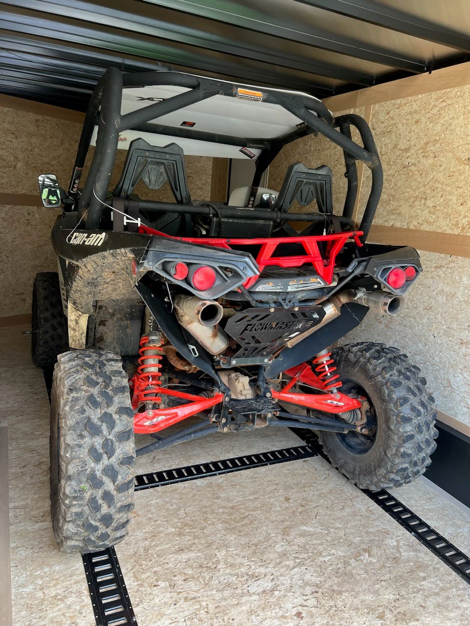 Enclosed trailer with a black Can-Am Maverick X3 side-by-side