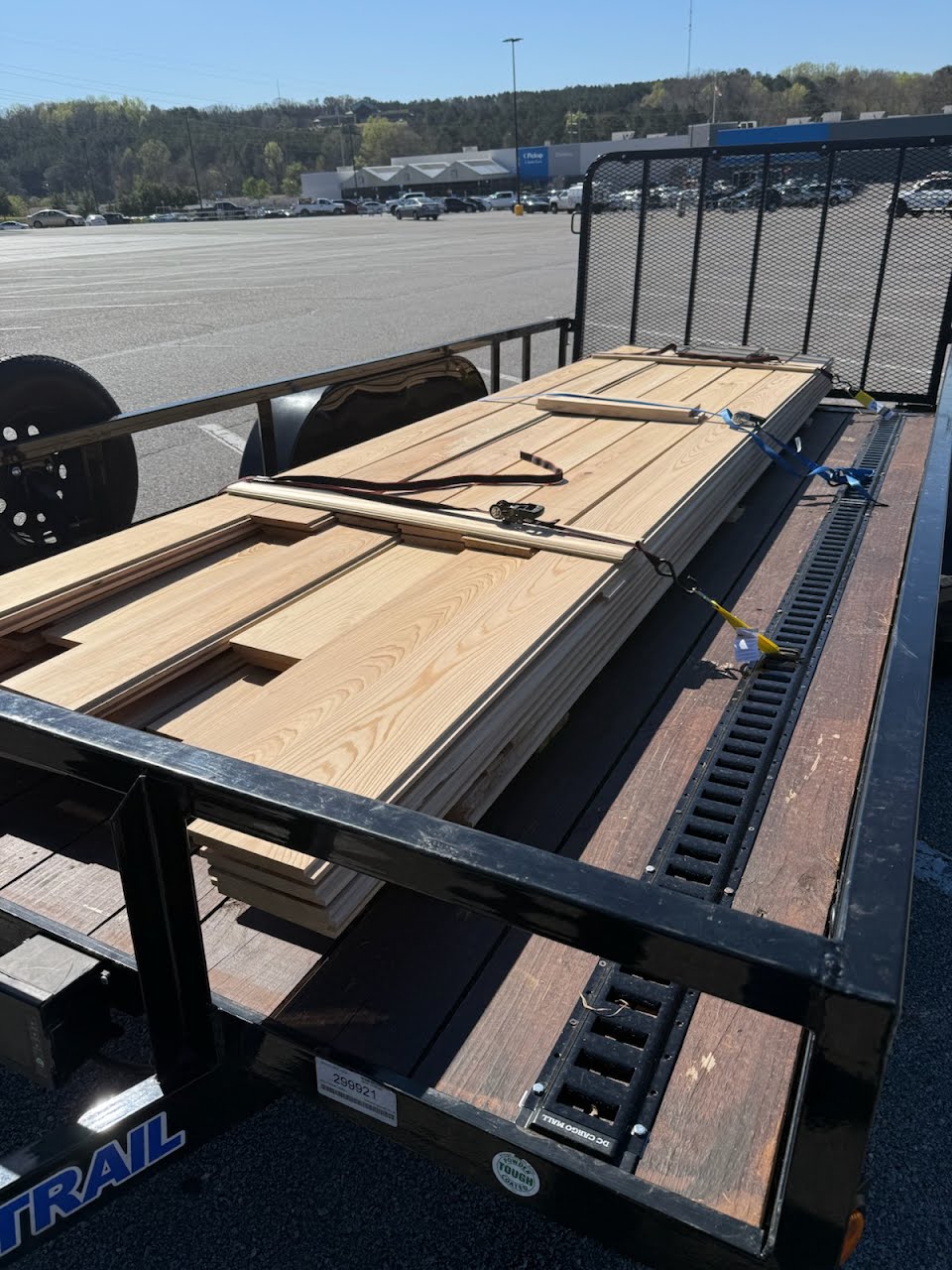 Utility trailer loaded with wooden planks
